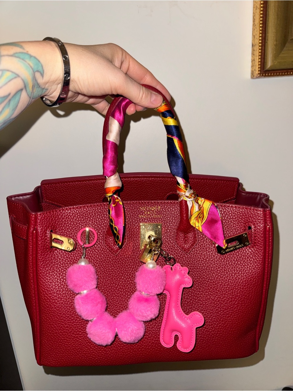 Designer-Style Red Structured Top-Handle Bag with Pink Pom Charm